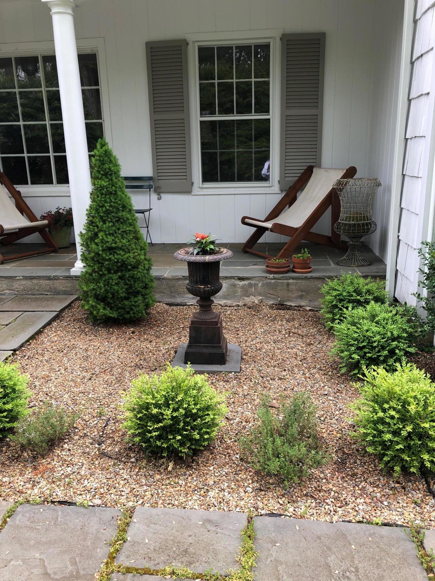 155 Michigan Road New Canaan, CT 06840 - Photo 34 of 40 a bench sitting in front of a house