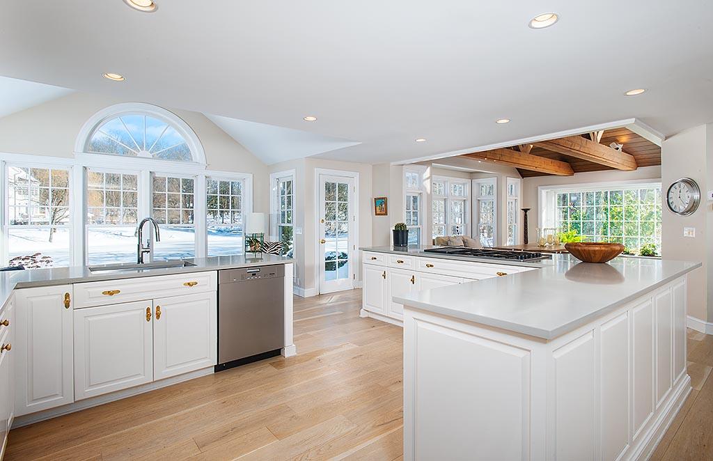 155 Michigan Road New Canaan, CT 06840 - Photo 7 of 40 a kitchen with stainless steel appliances granite countertop a sink and a stove