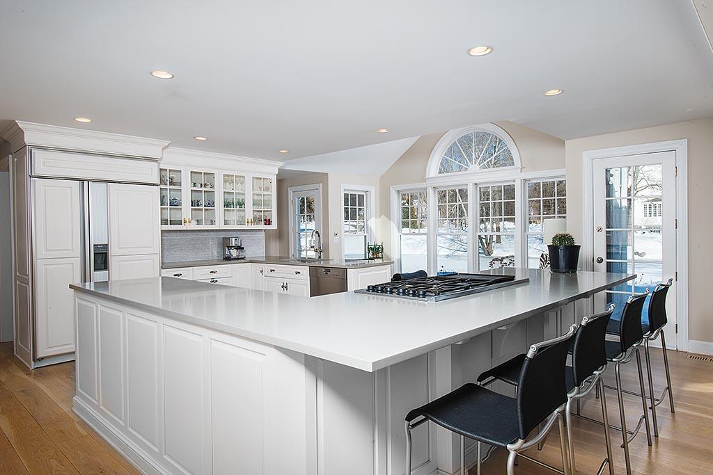 155 Michigan Road New Canaan, CT 06840 - Photo 8 of 40 a kitchen with counter top space and windows