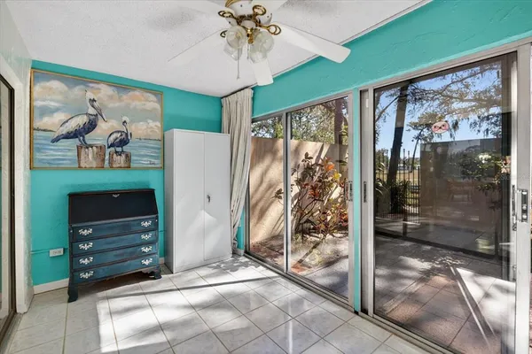 a view of a entryway door and chandelier