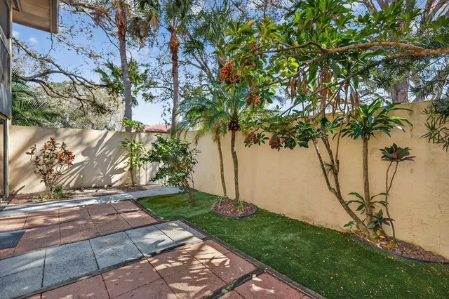 a view of yard with a fountain