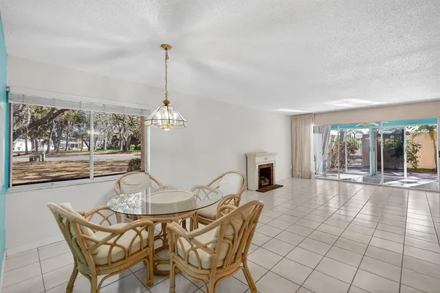 a dining room with furniture and window