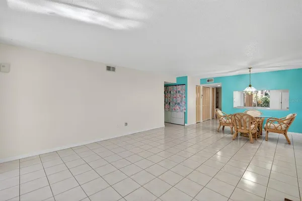a view of livingroom with furniture and dining table chair