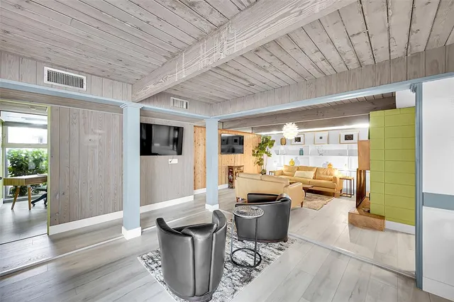 a room with lots of table and chairs