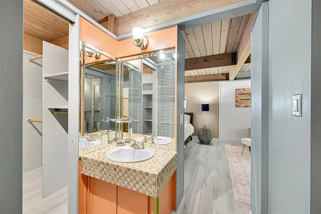 a bathroom with a sink and a mirror