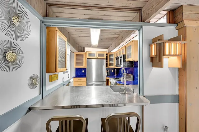 a view of kitchen and dining room with wooden floor
