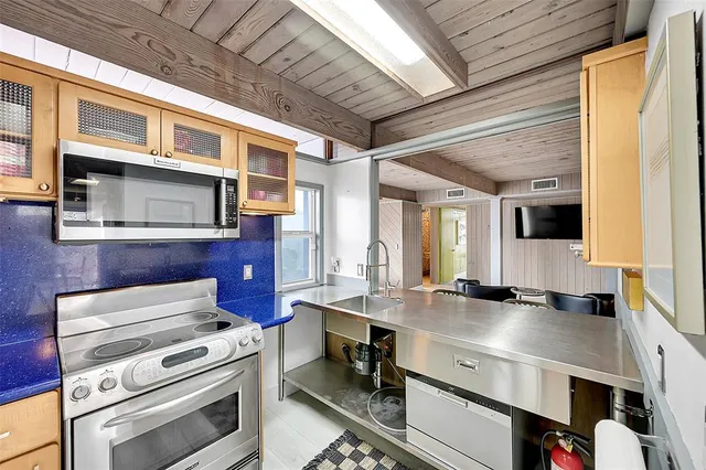 a kitchen with a stove and a sink
