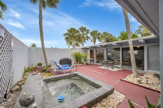 a view of an chairs and tables in the patio
