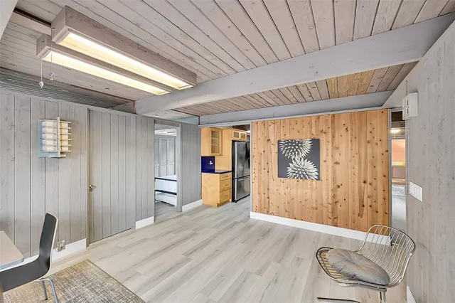 a bathroom with a granite countertop sink and a large mirror
