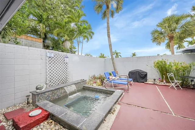 a backyard of a house with seating space