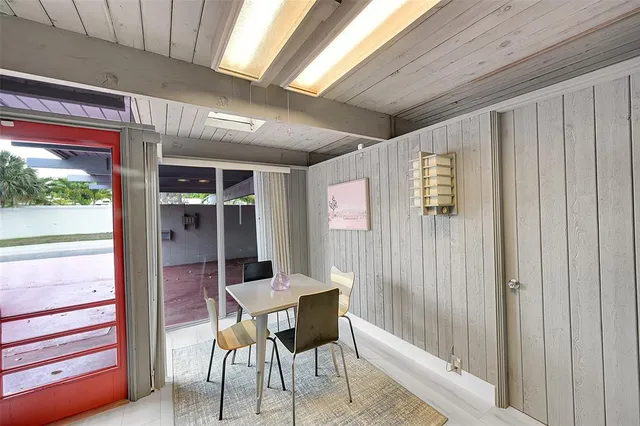 a view of a dining room with furniture window and outside view