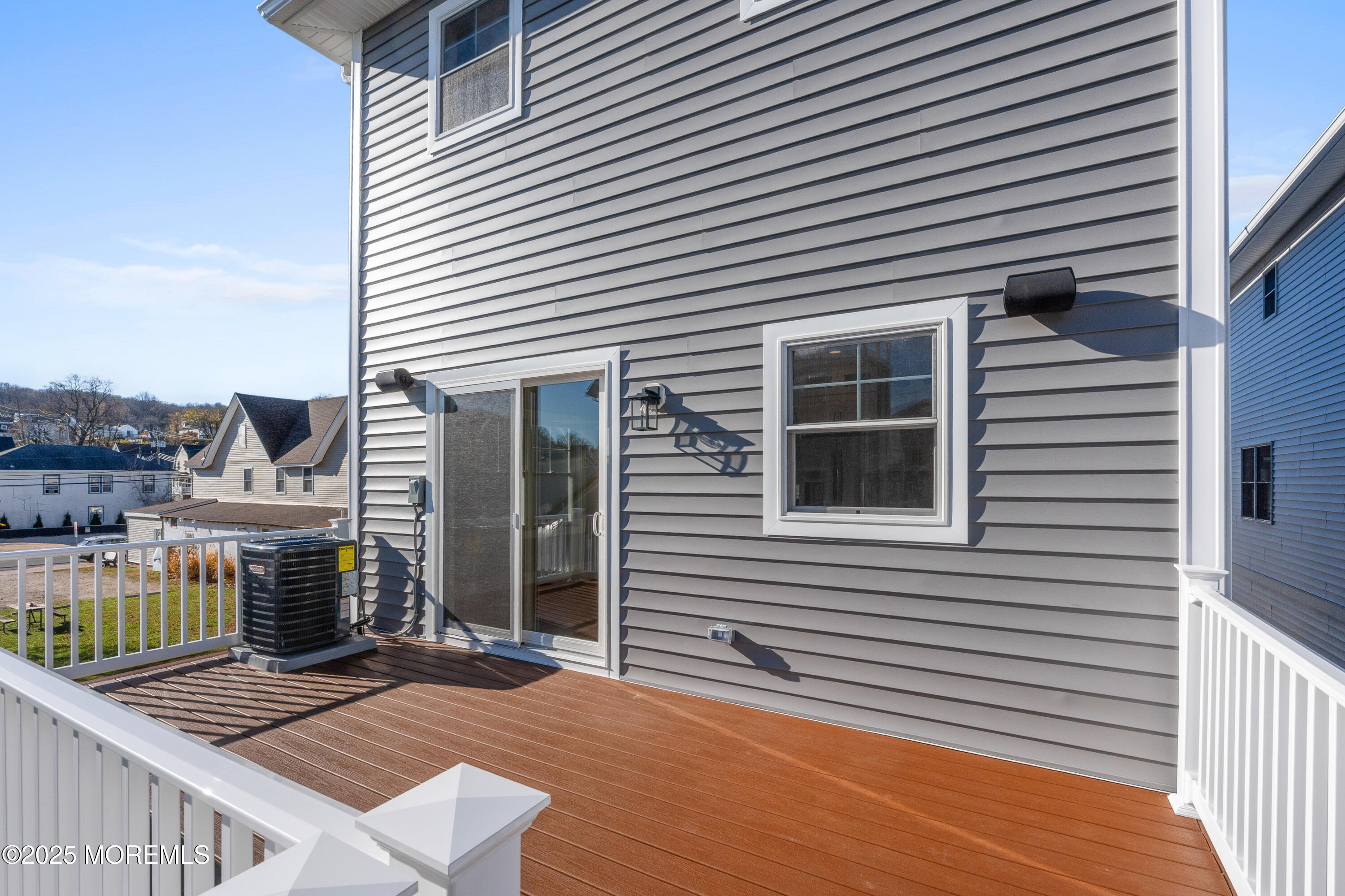Undisclosed Address Highlands, NJ 07732 - Photo 15 of 17 a view of a house with deck