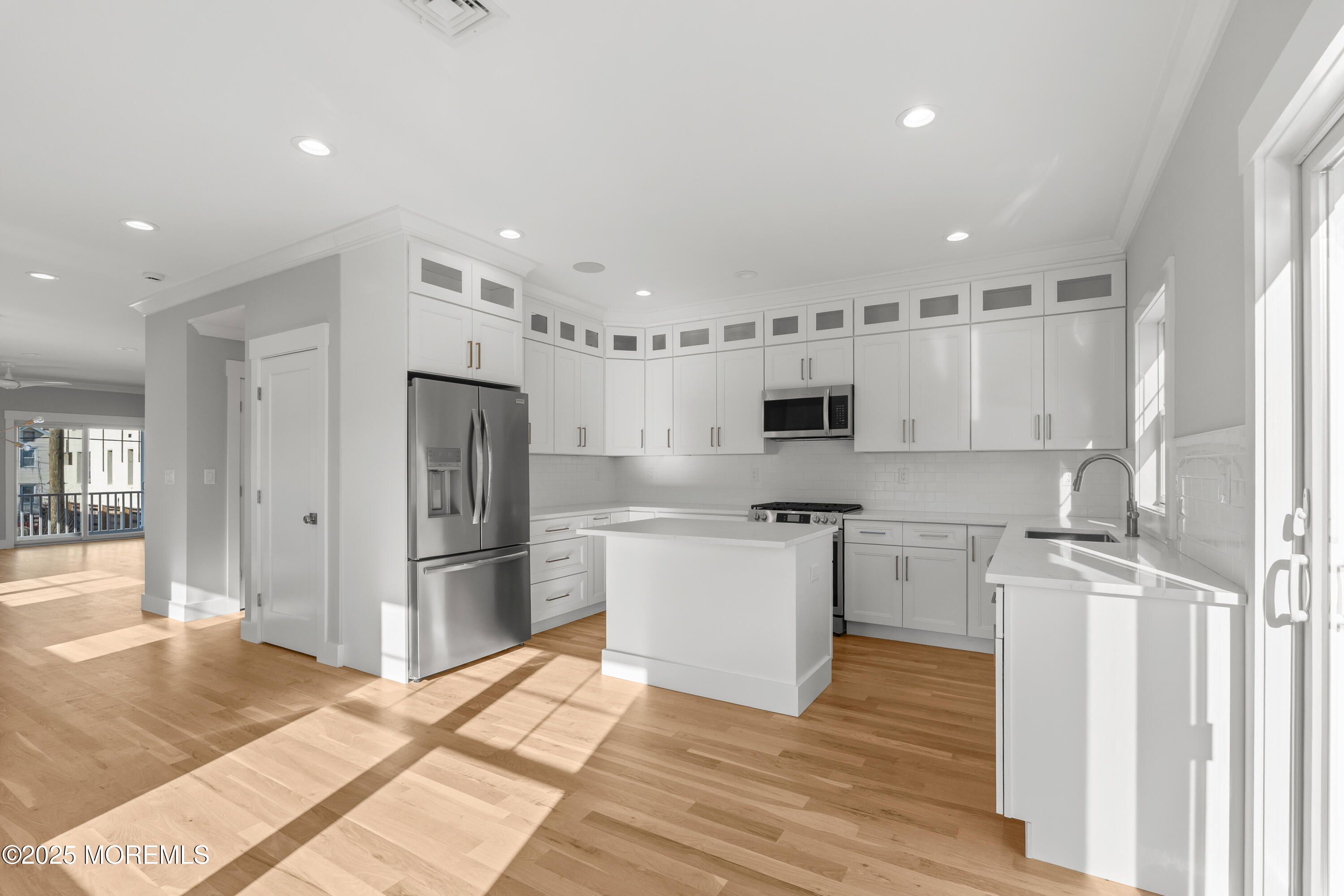 Undisclosed Address Highlands, NJ 07732 - Photo 4 of 17 a kitchen with stainless steel appliances a refrigerator stove microwave and cabinets