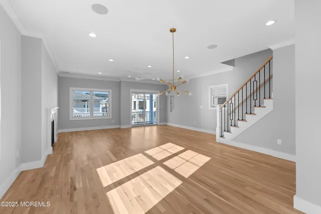 a view of an entryway with wooden floor