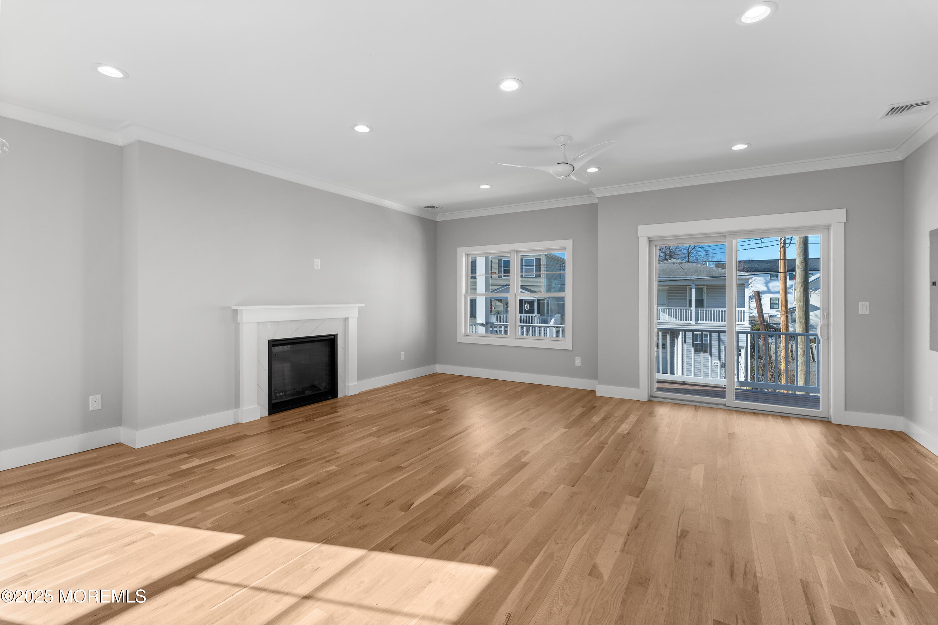 Undisclosed Address Highlands, NJ 07732 - Photo 7 of 17 a view of an empty room with wooden floor and a window