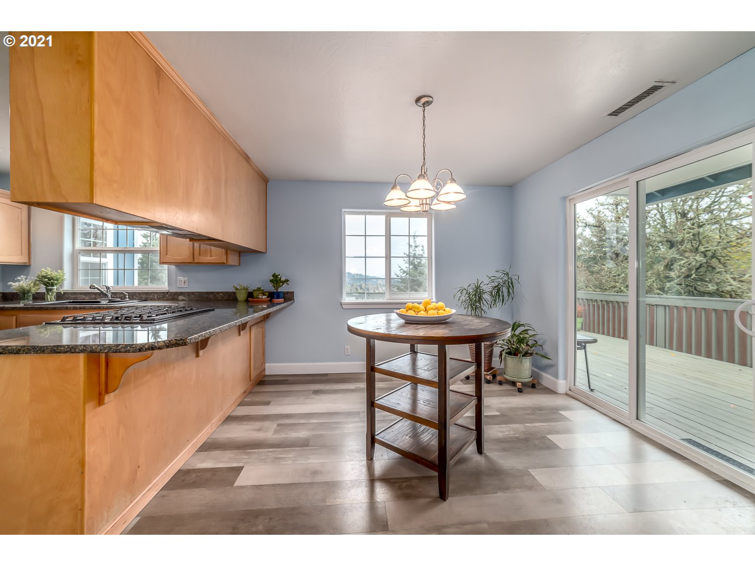 870 Kristen Way Cottage Grove, OR 97424 - Photo 11 of 31 a kitchen with stainless steel appliances granite countertop a stove a sink dishwasher and cabinets with wooden floor