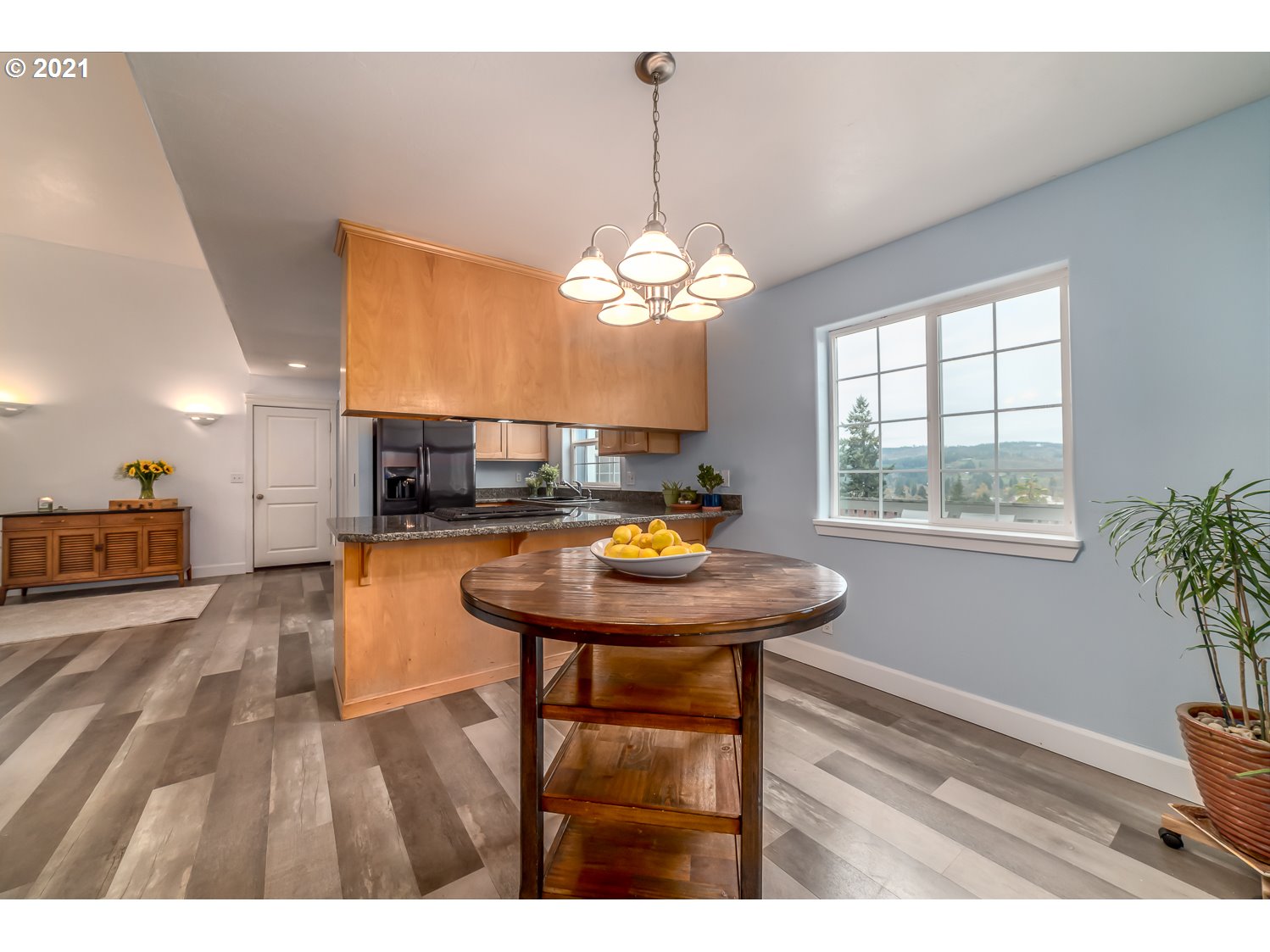 870 Kristen Way Cottage Grove, OR 97424 - Photo 12 of 31 a view of a dining room with furniture window and wooden floor