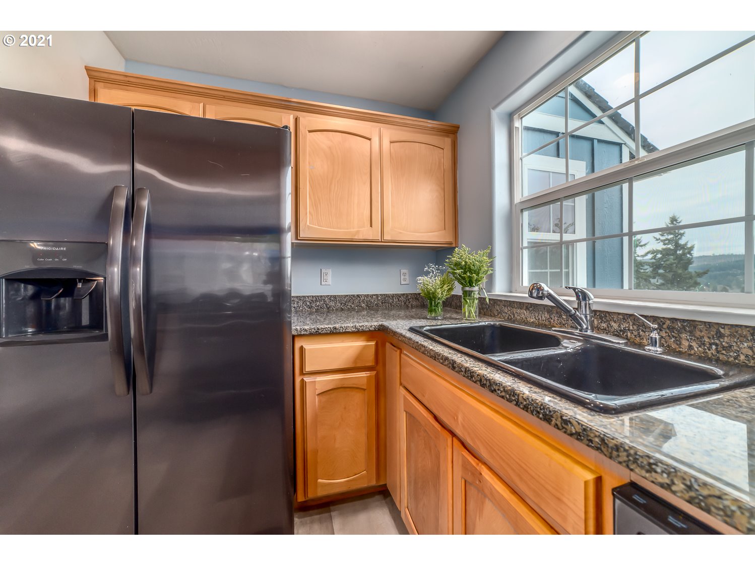 870 Kristen Way Cottage Grove, OR 97424 - Photo 14 of 31 a kitchen with stainless steel appliances granite countertop a sink and a refrigerator