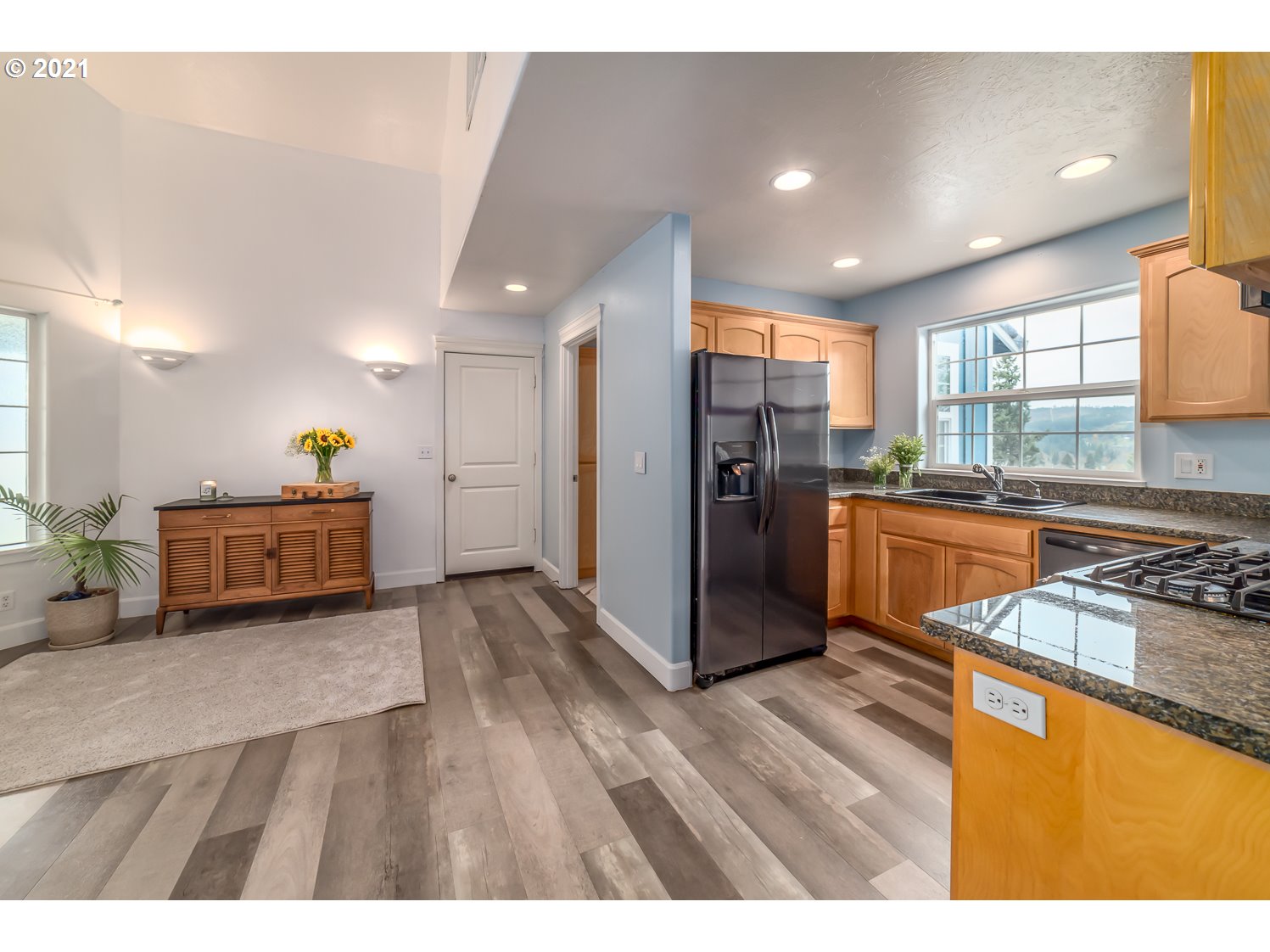 870 Kristen Way Cottage Grove, OR 97424 - Photo 16 of 31 a kitchen with stainless steel appliances granite countertop a stove a refrigerator a sink dishwasher and a oven with wooden floor