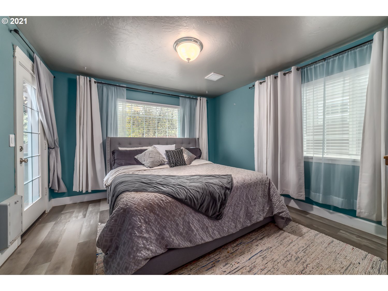 870 Kristen Way Cottage Grove, OR 97424 - Photo 18 of 31 a spacious bedroom with a bed and a window