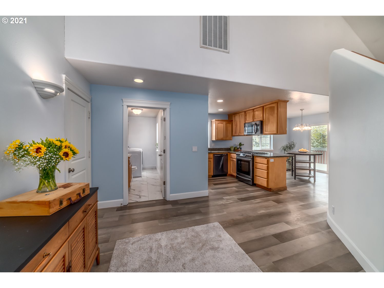 870 Kristen Way Cottage Grove, OR 97424 - Photo 27 of 31 a open kitchen with kitchen island a sink stainless steel appliances and cabinets