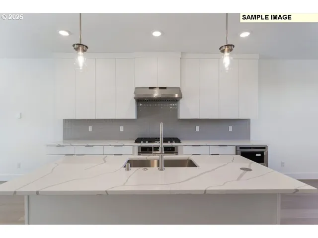 a kitchen with a stove and cabinets