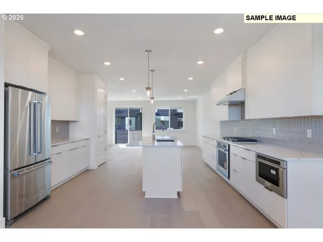 a kitchen with a sink stainless steel appliances and cabinets