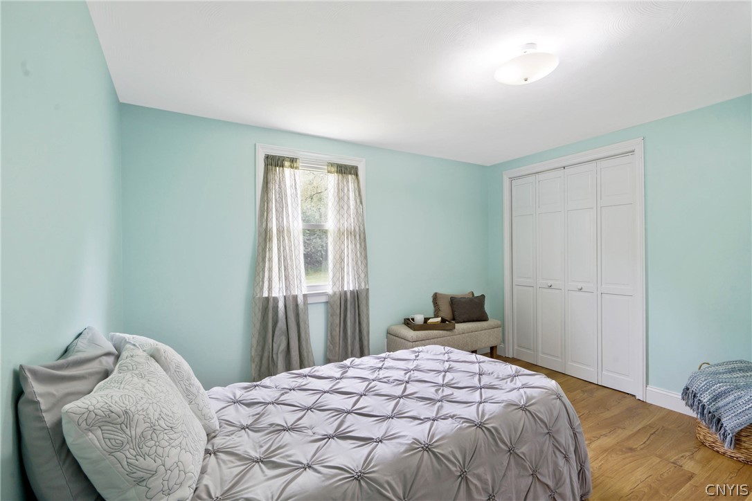 6130 South Bay Road Cicero, NY 13039 - Photo 19 of 30 This bedroom is large in size with one window overlooking the backyard and a double-door closet.