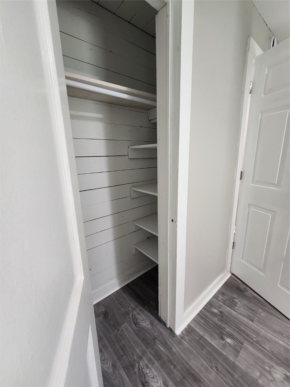 6203 Hoffman Street Houston, TX 77028 - Photo 12 of 19 a view of walk in closet with empty racks