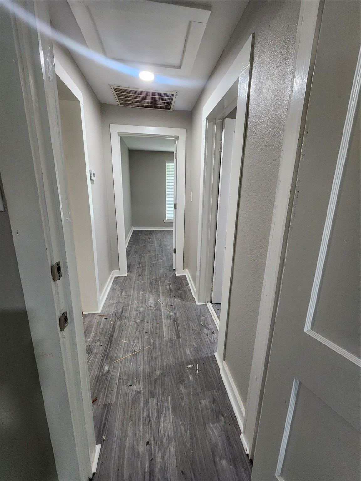 6203 Hoffman Street Houston, TX 77028 - Photo 16 of 19 a view of a hallway with wooden floor