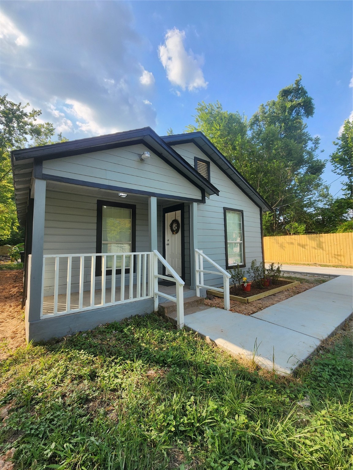 6203 Hoffman Street Houston, TX 77028 - Photo 2 of 19 a view of a house with a yard and sitting area