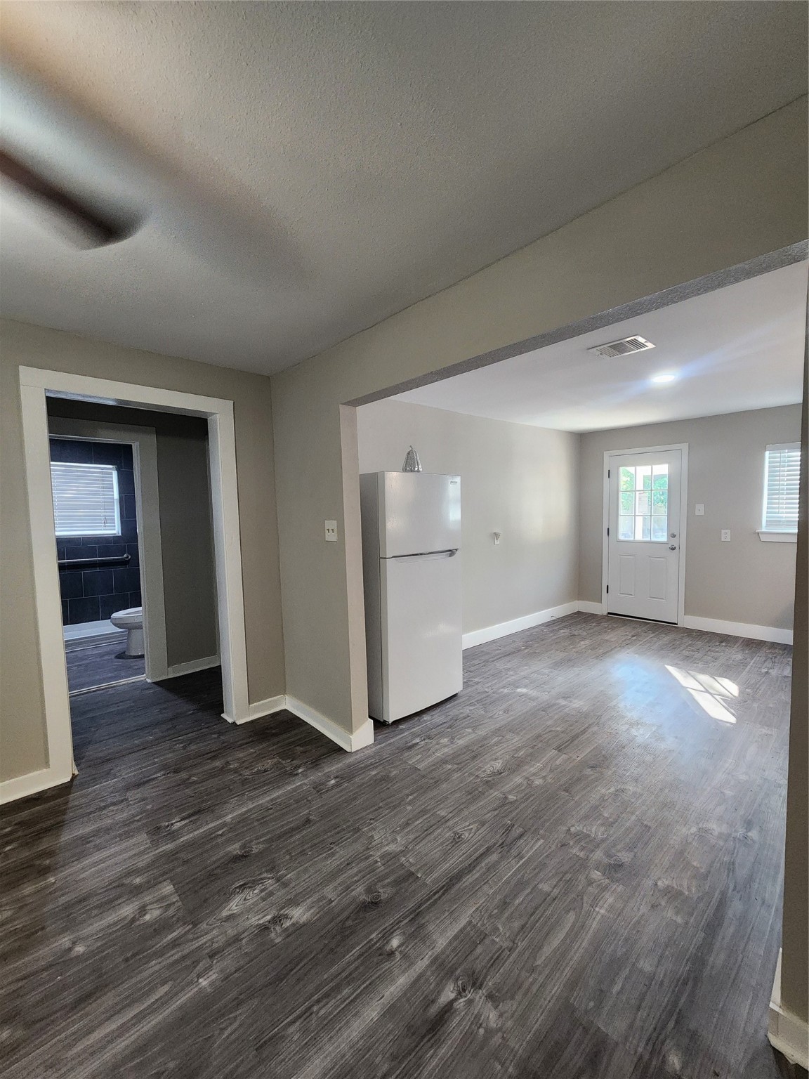 6203 Hoffman Street Houston, TX 77028 - Photo 6 of 19 a view of empty room with wooden floor