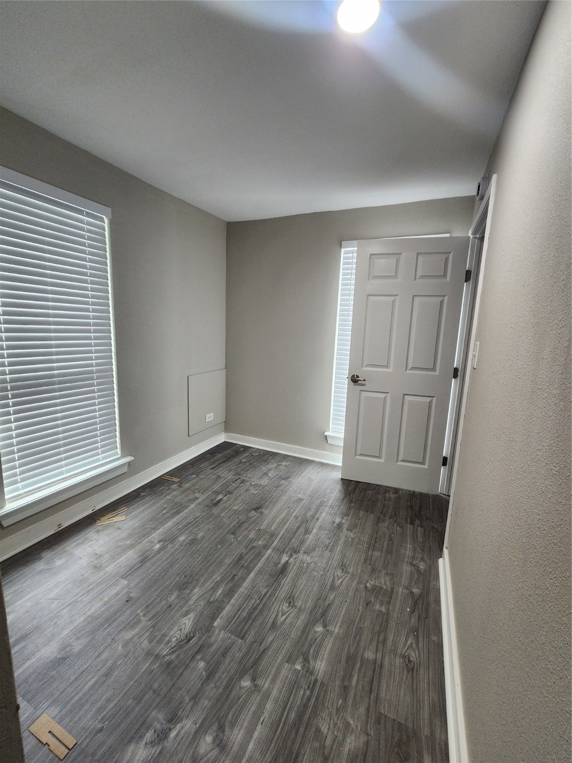 6203 Hoffman Street Houston, TX 77028 - Photo 7 of 19 a view of an empty room with wooden floor and a window