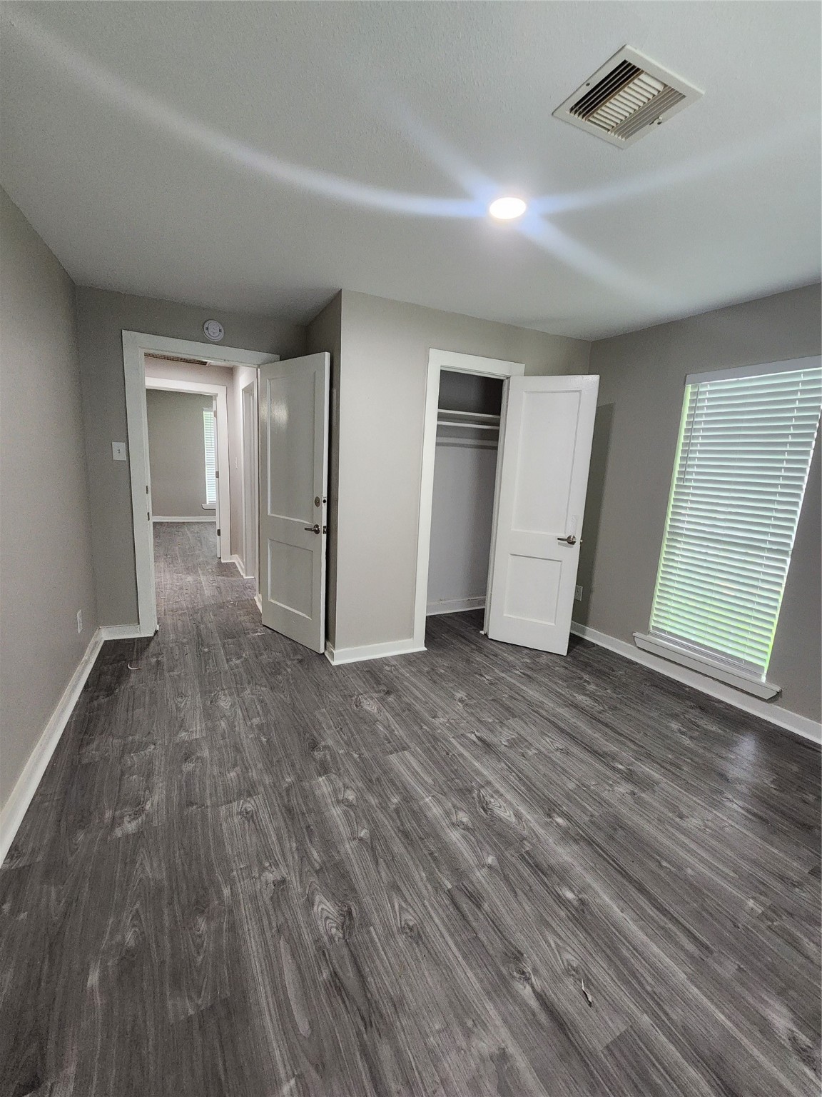 6203 Hoffman Street Houston, TX 77028 - Photo 9 of 19 a view of empty room with wooden floor and window