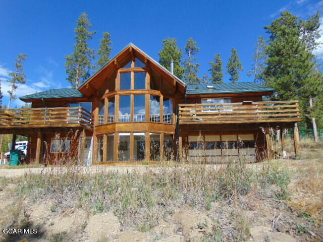 a view of a large house with a window and a yard