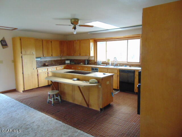 446 County Road 86 Tabernash, CO 80478 - Photo 13 of 36 a kitchen with a sink a window and chairs