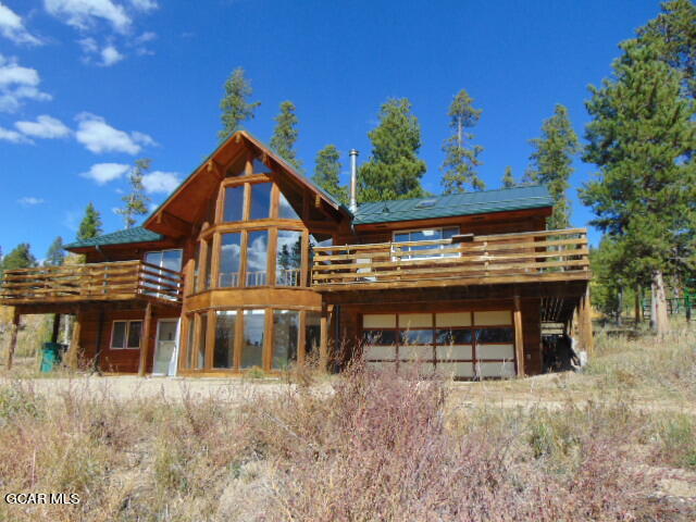 446 County Road 86 Tabernash, CO 80478 - Photo 2 of 36 a view of a house with a yard and sitting area