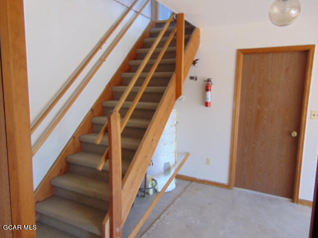 446 County Road 86 Tabernash, CO 80478 - Photo 25 of 36 a view of staircase with white walls and a window