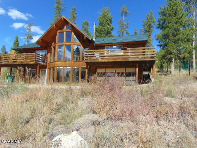 446 County Road 86 Tabernash, CO 80478 - Photo 3 of 36 a view of a house with a chairs and table in a patio