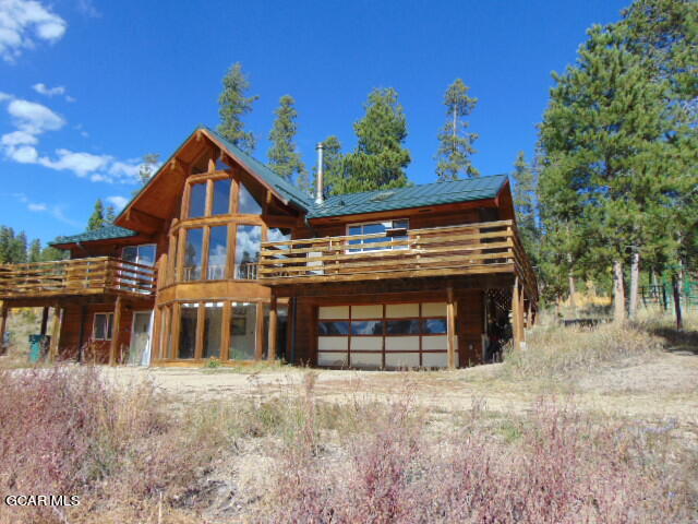 446 County Road 86 Tabernash, CO 80478 - Photo 4 of 36 a front view of a house with a yard