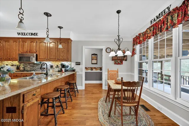 a bathroom with a tub shower and mirror