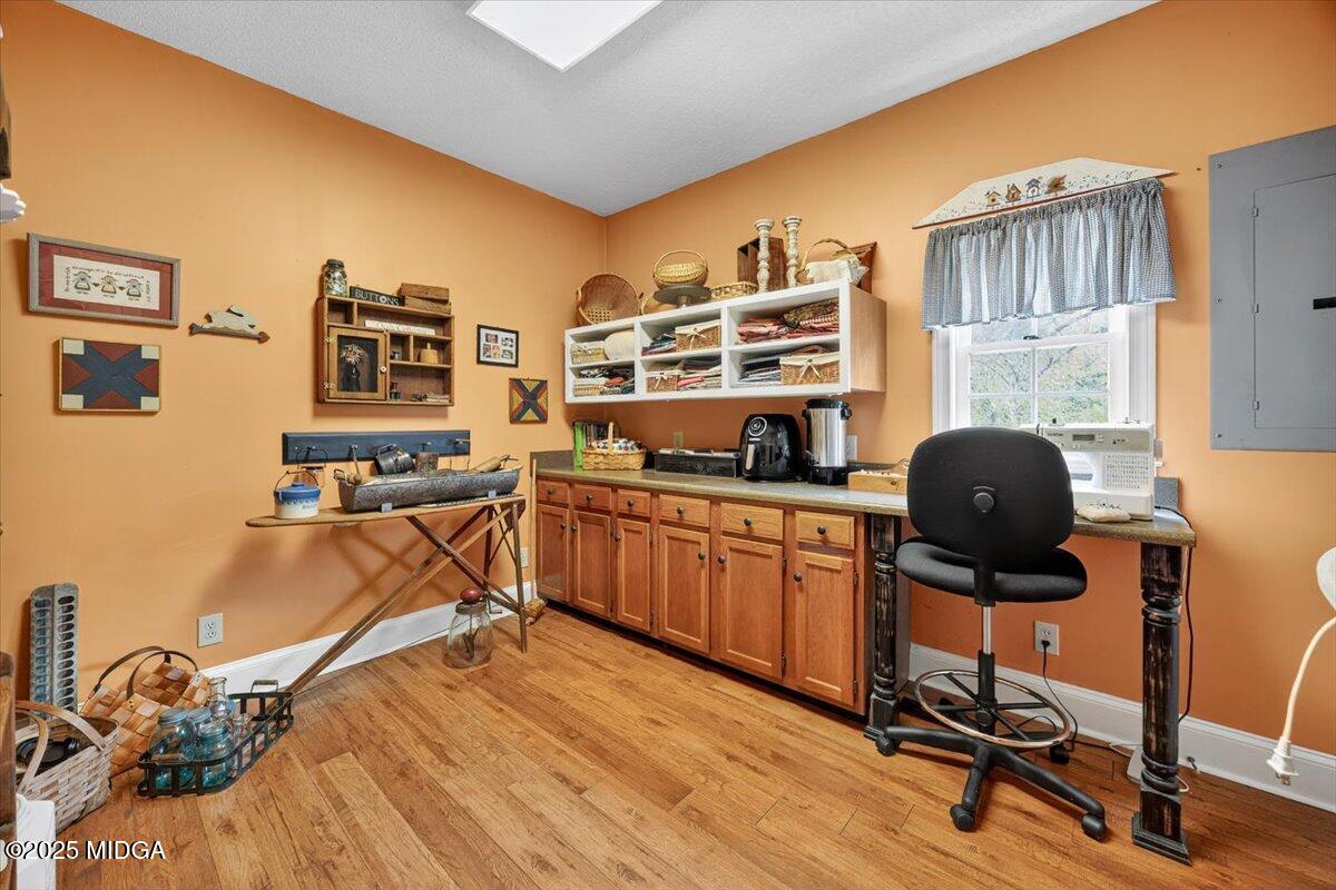 5771 Rogers Road Lizella, GA 31052 - Photo 28 of 74 a view of a workspace with furniture and a window