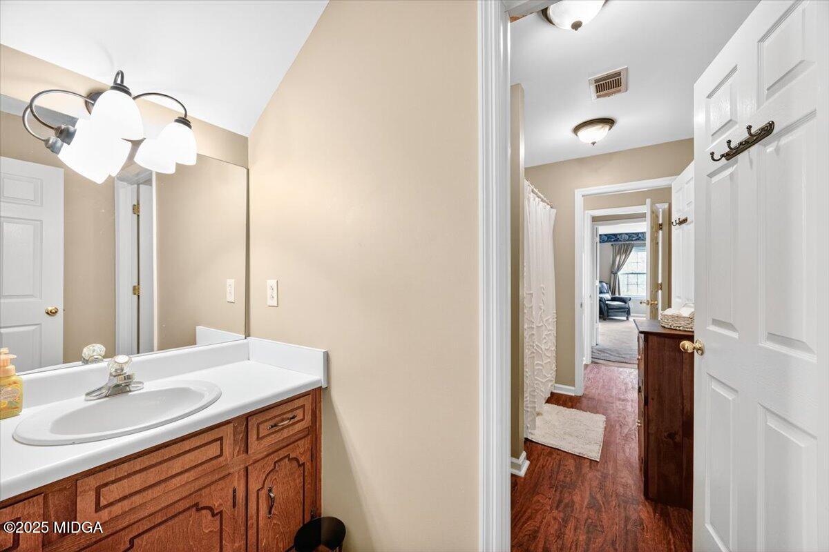 5771 Rogers Road Lizella, GA 31052 - Photo 39 of 74 a bathroom with a sink and a mirror