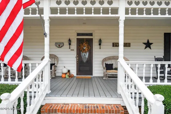 a view of balcony with furniture