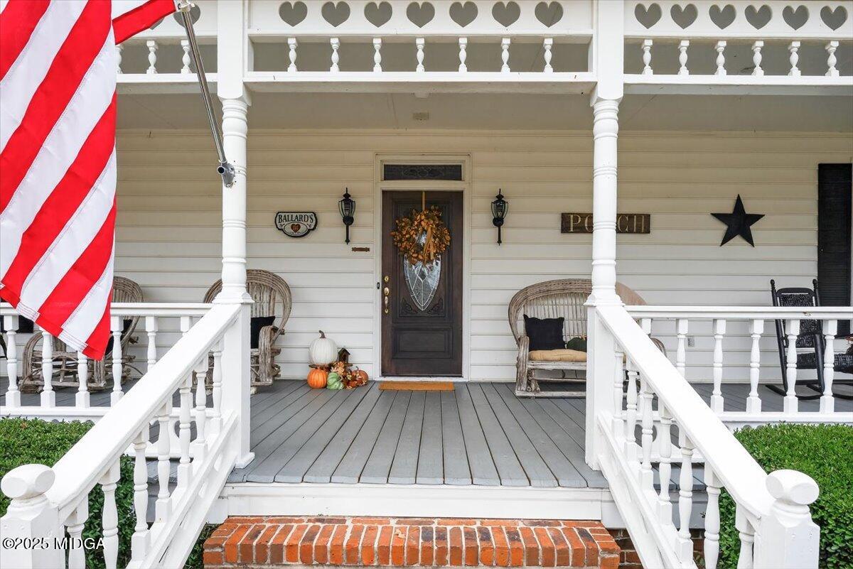 5771 Rogers Road Lizella, GA 31052 - Photo 4 of 74 a view of balcony with wooden floor and dining space
