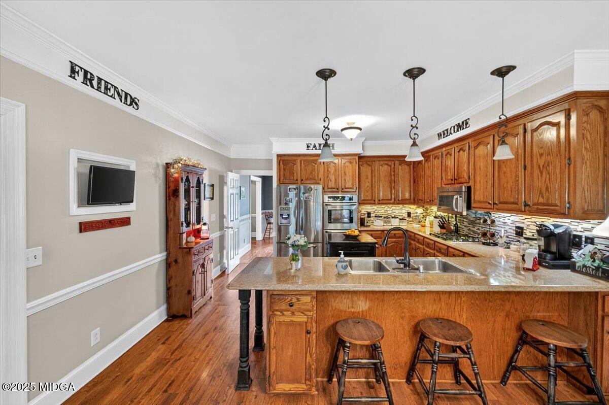 5771 Rogers Road Lizella, GA 31052 - Photo 44 of 74 a kitchen with furniture a counter top space and stainless steel appliances