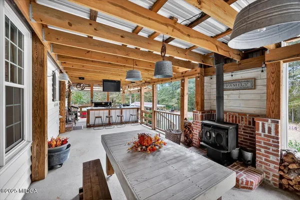an aerial view of residential houses with outdoor space and trees