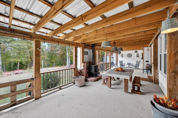 an aerial view of a house with a yard and lake view