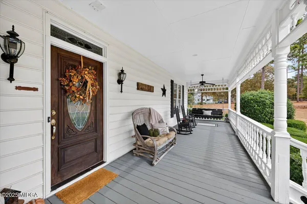 a view of entryway livingroom and hall with wooden floor