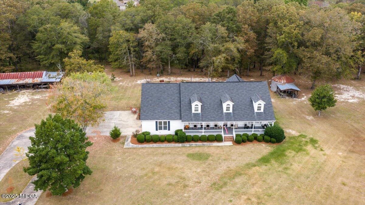 5771 Rogers Road Lizella, GA 31052 - Photo 65 of 74 aerial view of a house with a yard and a large tree